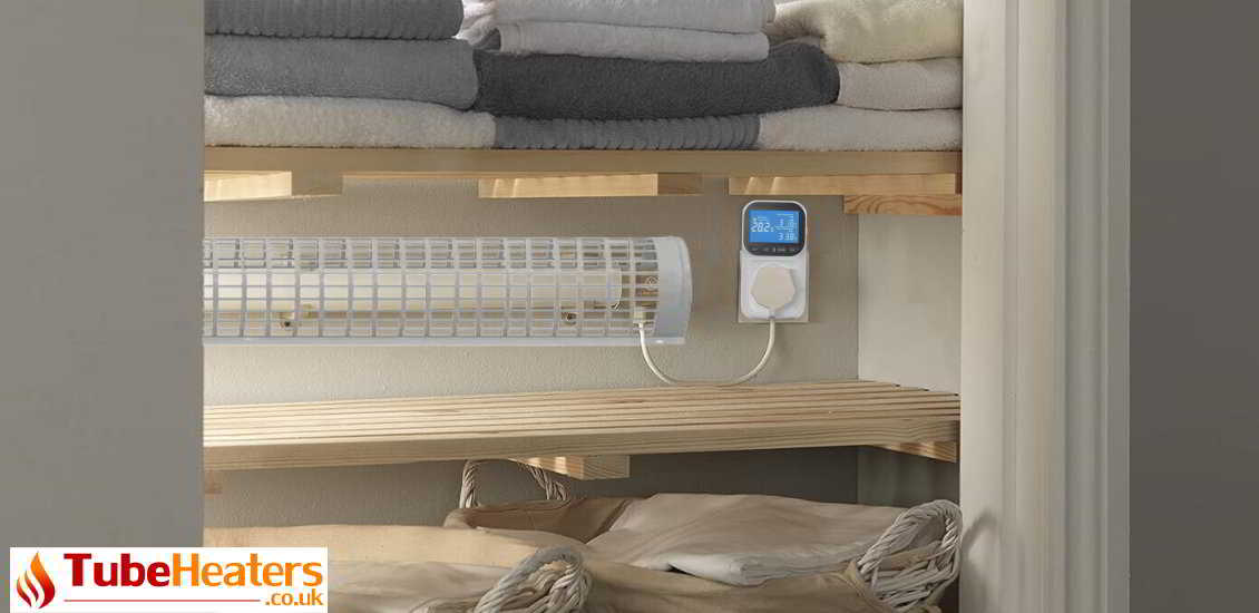 Airing cupboard radiator with guard and thermostat